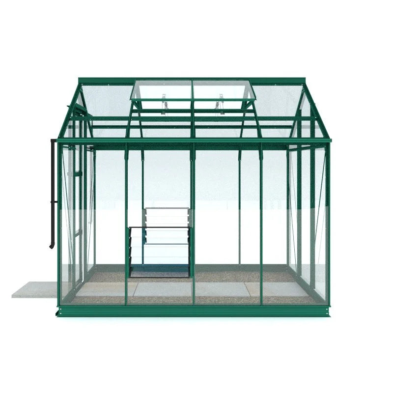A green metal-framed Rhino Greenhouse with transparent glass panels sits empty, featuring a sliding door and roof vents. It is positioned on a slatted stone base, indoors.