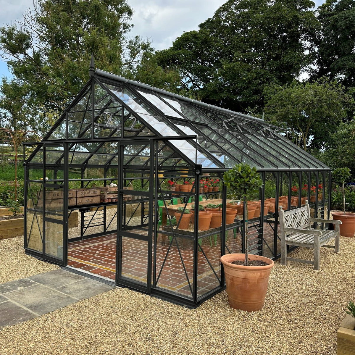 12x20 midnight slate greenhouse with a dining area inside