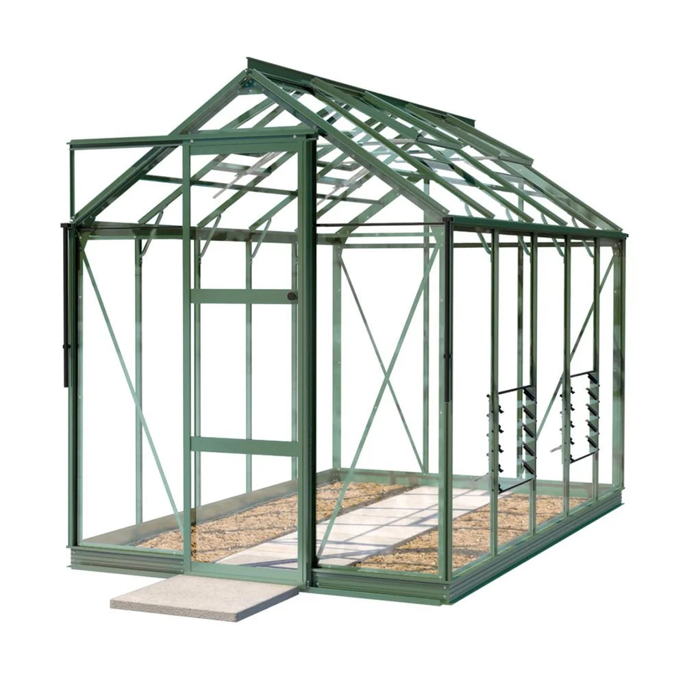 A green metal-framed Rhino Greenhouse stands on gravel, featuring a door and glass panels, with a small step leading inside. The structure is set in a neutral-white background.