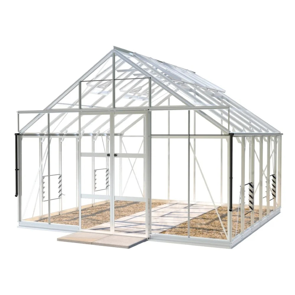 A white-framed Rhino Greenhouse stands with open doors, revealing an empty interior on a stone surface. It features transparent panels and appears ready for gardening within a spacious environment.