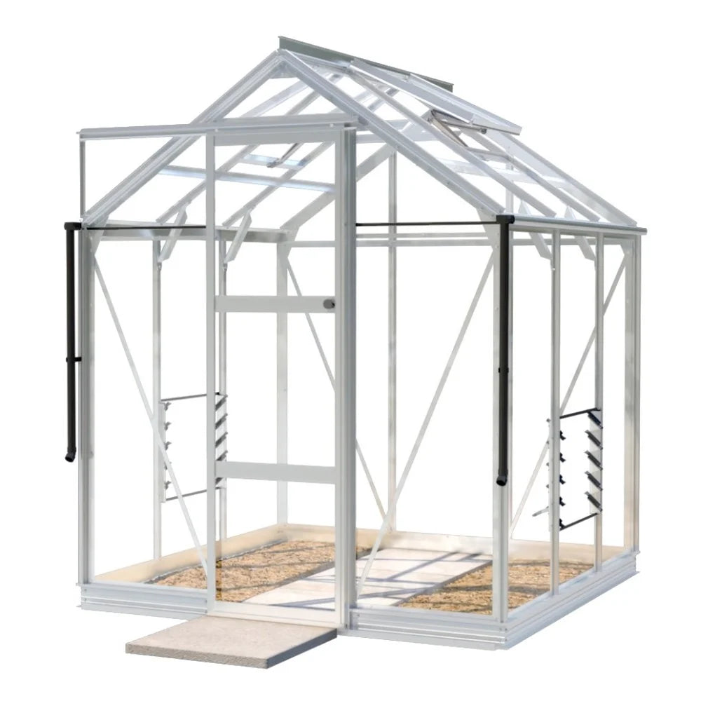 A transparent, rectangular Rhino Greenhouse structure standing on a concrete base, featuring multiple glass panels, hinged roof windows, and metal frame supports, set in a minimal, isolated white background.