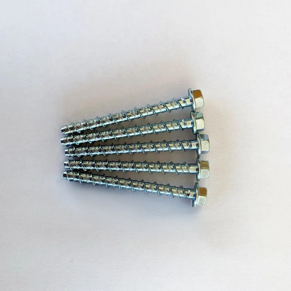 Five silver metal screws lying side by side on a plain white surface, aligned neatly with hexagonal heads facing outward.