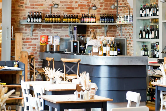 Beautiful counter surrounded by white and beer bottles.