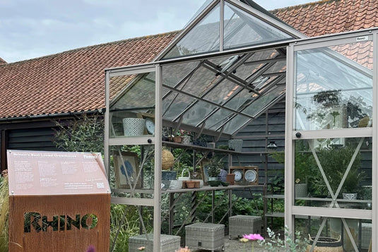 Rhino greenhouse and corten steel sign at letheringsett